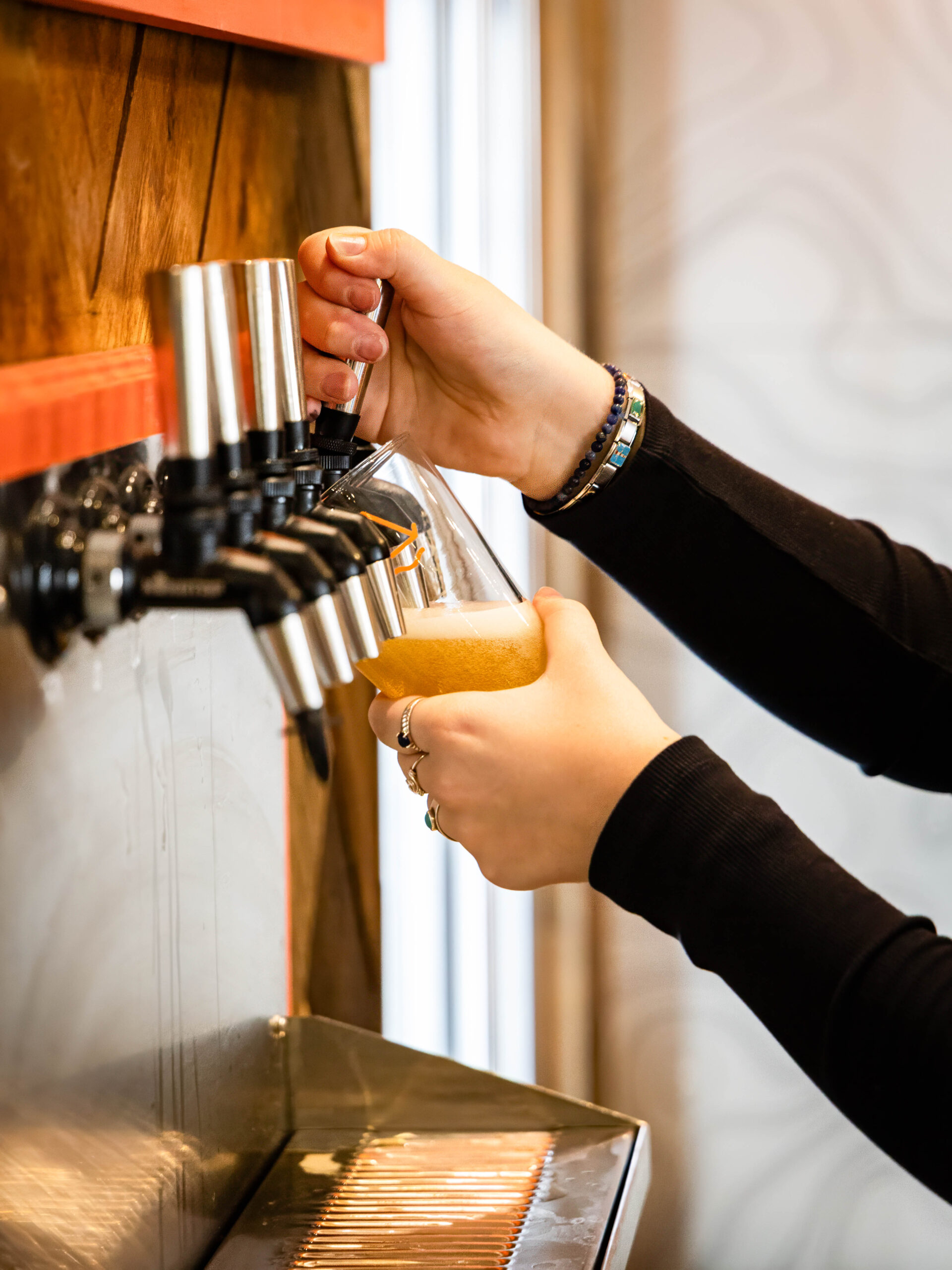 Pouring beer at Base Camp Brewing